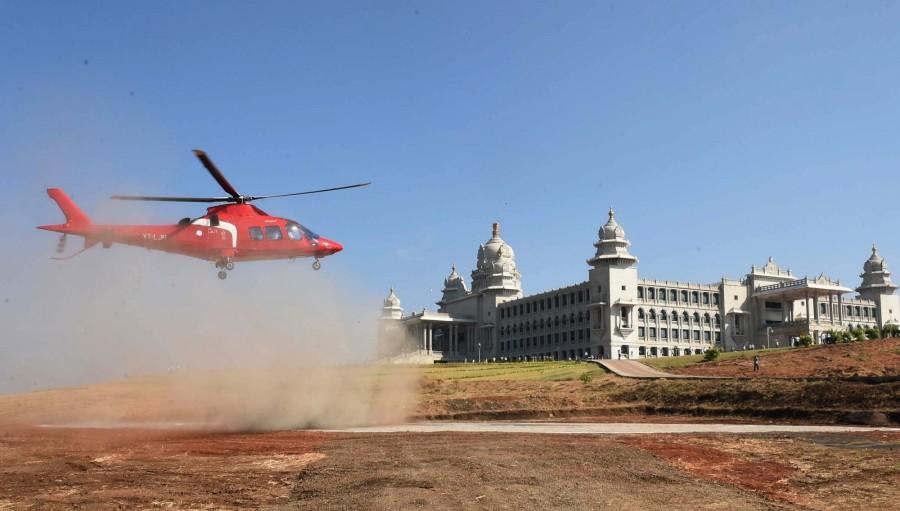 Photos of Karnataka Chief Minister Siddaramaiah arrives from a helicopter, after a new helipad constructed at Suvarna Soudha in Belagavi, for the winter session of the Karnataka Assembly on Nov 22, 2016. Siddaramaiah,CM Siddaramaiah,CM Siddaramaiah arrives at Suvarna Soudha by helicopter,Siddaramaiah arrives at Suvarna Soudha by helicopter,CM Siddaramaiah arrives at Suvarna Soudha