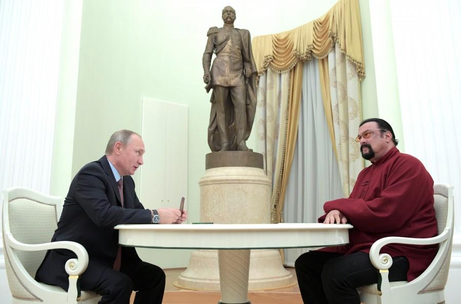 Vladimir Putin holds a Russian passport before presenting it to Steven Seagal. For more than a decade Seagal, who according to his own website is 64, has been a regular visitor to Russia. His movies, including such titles as "Under Siege" and "Sniper: Special Ops," are popular with Russian audiences. Vladimir Putin,President Vladimir Putin,Putin,Steven Seagal,actor Steven Seagal,US actor Steven Seagal,Russian passport to US actor Steven Seagal