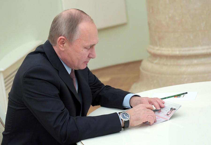 Vladimir Putin holds a Russian passport before presenting it to Steven Seagal. At a Kremlin ceremony where Seagal signed his new passport in front of Putin, the Russian leader said: "I want to congratulate you and express the hope that this is another, albeit small, gesture and it might be a sign of the gradual normalization of relations between our countries." Vladimir Putin,President Vladimir Putin,Putin,Steven Seagal,actor Steven Seagal,US actor Steven Seagal,Russian passport to US actor Steven Seagal