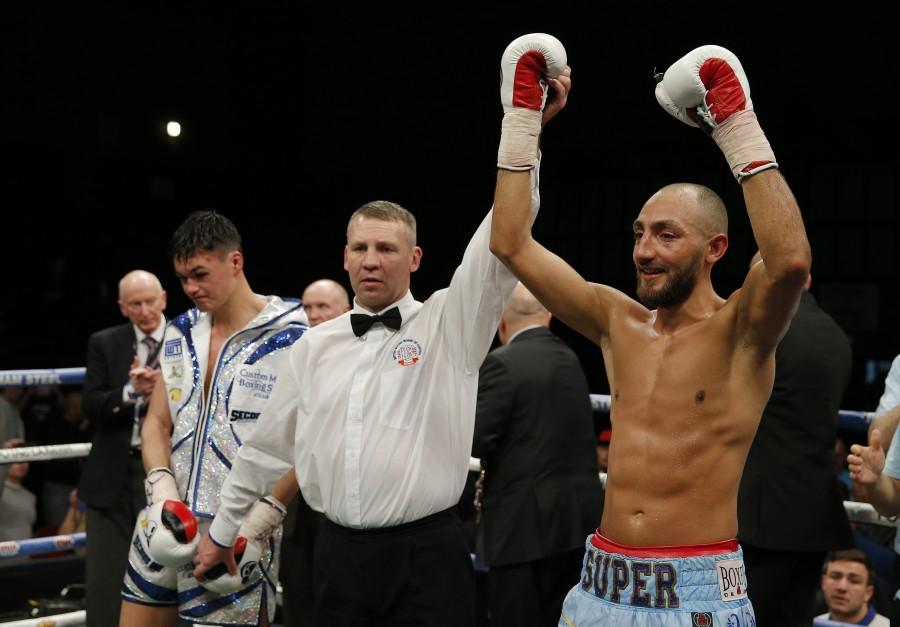 Britain Boxing - Bradley Skeete v John Thain British Welterweight Title - Brentwood Centre - 25/11/16 Bradley Skeete celebrates winning the fight as John Thain looks on dejected Mandatory. Bradley Skeete,John Thain,Bradley Skeete beats John Thain,British welterweight title,welterweight title,Britain Boxing