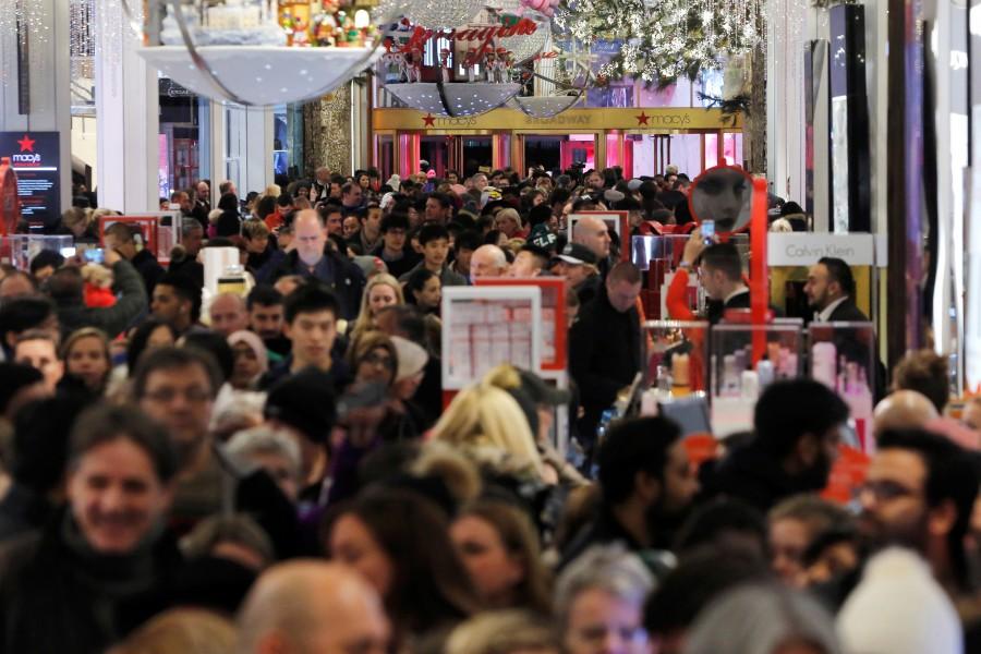 People walk through Macy's Herald Square store in Manhattan, New York. Thanksgiving,Thanksgiving bargain hunt,Black Friday frenzy,Black Friday frenzy pics,Black Friday frenzy images,Black Friday frenzy photos,Black Friday frenzy stills,Black Friday frenzy pictures