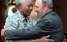 Former South African President Nelson Mandela (L) hugs Cuba's President Fidel Castro during a visit to Mandela's home in Houghton, Johannesburg in this September 2, 2001 file photo. Ailing Cuban leader Castro said on February 19, 2008 that he will not return to lead the country, retiring as head of state 49 years after he seized power in an armed revolution.