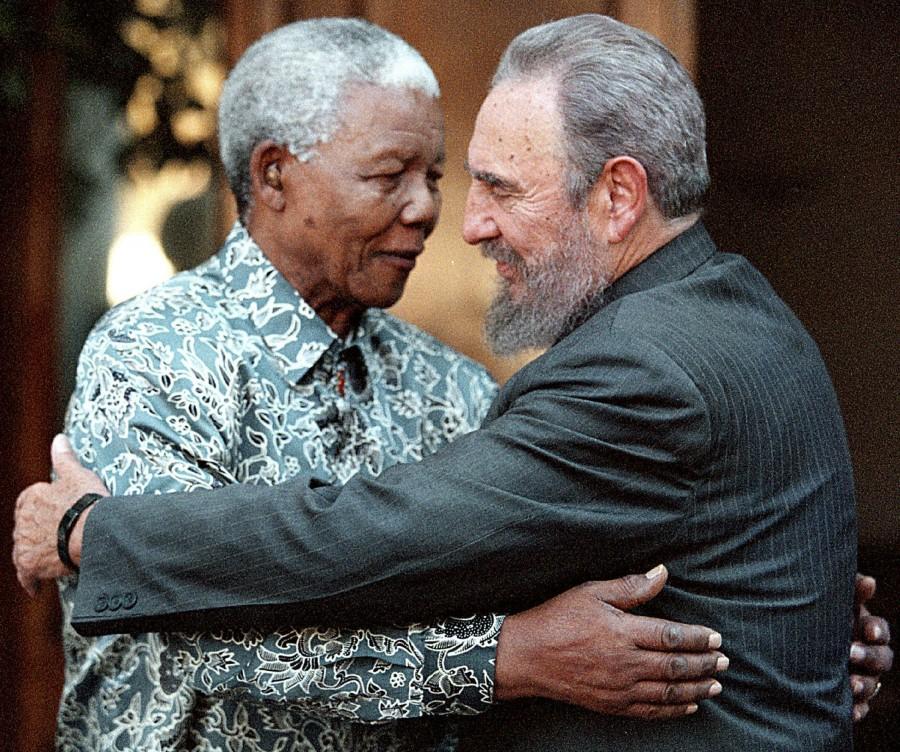 Former South African President Nelson Mandela (L) hugs Cuba's President Fidel Castro during a visit to Mandela's home in Houghton, Johannesburg in this September 2, 2001 file photo. Ailing Cuban leader Castro said on February 19, 2008 that he will not return to lead the country, retiring as head of state 49 years after he seized power in an armed revolution. Fidel Castro,Fidel Castro dead,Fidel Castro cuba,Fidel Castro dies,Fidel Castro passes away,Fidel Castro Iconic photos,Fidel Castro Iconic pics,Fidel Castro Iconic images,Fidel Castro rare pics,Fidel Castro rare images,Fidel Castro rare photos,Fidel Castr