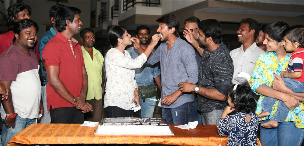 South Indian actor Udhayanidhi Stalin celebrated his Birthday at the Sets Gaurav Narayanan movie shoot. Celebs like Soori, Manjima Mohan, Daniel Balaji and others graced the event. Manjima Mohan,Soori,Udhayanidhi Stalin birthday celebration,Udhayanidhi Stalin birthday,Udhayanidhi Stalin,Udhayanidhi Stalin birthday celebration pics,Udhayanidhi Stalin birthday celebration images,Udhayanidhi Stalin birthday celebration photos,Udhayanid