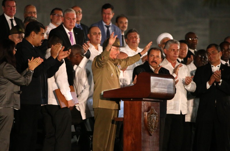Cuban President Raul Castro acknowledges the applause from the crowd as he attends a massive tribute to Cuba's late President Fidel Castro in Revolution Square in Havana. Havana,tribute to Fidel,Raul Castro,Fidel Castro,tribute to Fidel Castro