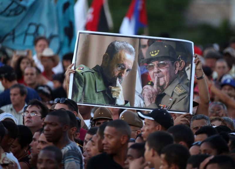 Attendees hold portraits of Cuba's late President Fidel Castro and current President Raul Castro. Havana,tribute to Fidel,Raul Castro,Fidel Castro,tribute to Fidel Castro
