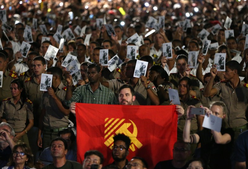 Cadets and sailors hold images of Cuba's late President Fidel Castro as they pay tribute. Havana,tribute to Fidel,Raul Castro,Fidel Castro,tribute to Fidel Castro