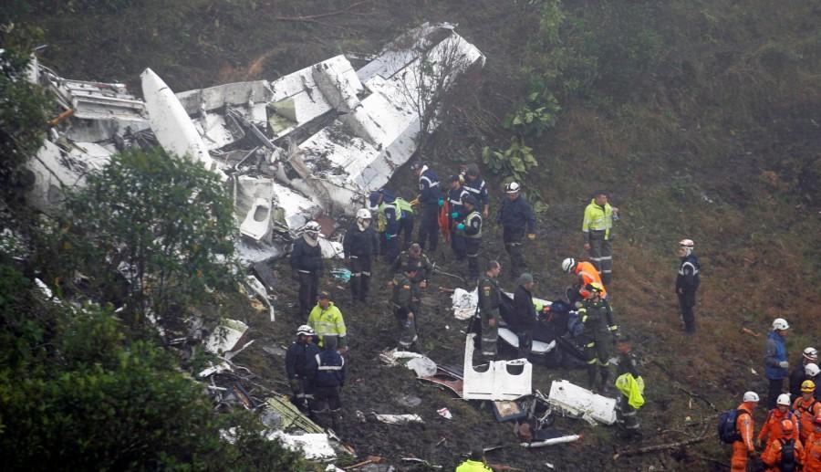 Rescue crews work in the wreckage from a plane that crashed into Colombian jungle with Brazilian soccer team Chapecoense onboard near Medellin, Colombia, November 29, 2016. Brazilian soccer team crashes,Plane crash,Brazilian soccer team,Chapecoense,Colombian mountains