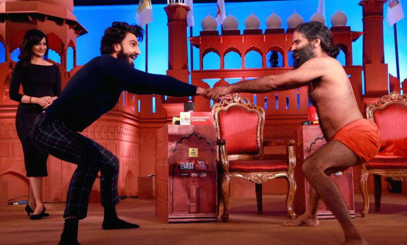 Photos of Bollywood actor Ranveer Singh performs Yoga with Baba Ramdev in New Delhi. Ranveer Singh performs Yoga,Ranveer Singh performs Yoga with Baba Ramdev,Ranveer Singh,Ranveer Singh and Baba Ramdev,Ranveer Singh with Baba Ramdev