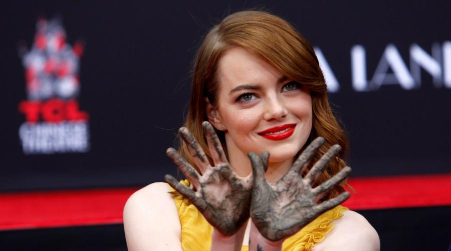 Photos of Emma Stone and Ryan Gosling place their hands in cement at the TCL Chinese theatre in Hollywood. Emma Stone and Ryan Gosling,Emma Stone,Ryan Gosling,Ryan Gosling and Emma Stone cemented,TCL Chinese theatre,Chinese theatre,Ryan Gosling and Emma Stone pics,Ryan Gosling and Emma Stone images,Ryan Gosling and Emma Stone photos,Ryan Gosling and Emma Stone