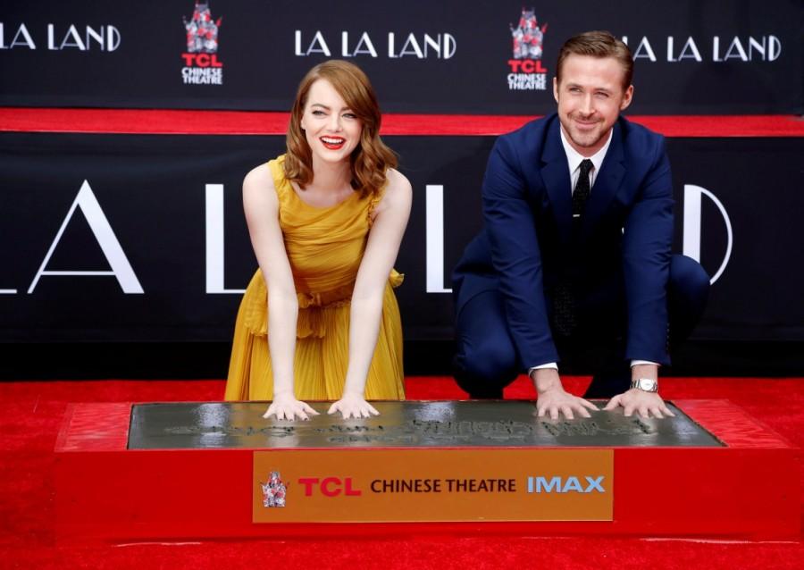 Photos of Emma Stone and Ryan Gosling place their hands in cement at the TCL Chinese theatre in Hollywood. Emma Stone and Ryan Gosling,Emma Stone,Ryan Gosling,Ryan Gosling and Emma Stone cemented,TCL Chinese theatre,Chinese theatre,Ryan Gosling and Emma Stone pics,Ryan Gosling and Emma Stone images,Ryan Gosling and Emma Stone photos,Ryan Gosling and Emma Stone