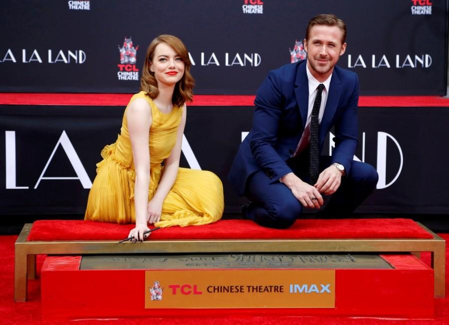 Photos of Emma Stone and Ryan Gosling place their hands in cement at the TCL Chinese theatre in Hollywood. Emma Stone and Ryan Gosling,Emma Stone,Ryan Gosling,Ryan Gosling and Emma Stone cemented,TCL Chinese theatre,Chinese theatre,Ryan Gosling and Emma Stone pics,Ryan Gosling and Emma Stone images,Ryan Gosling and Emma Stone photos,Ryan Gosling and Emma Stone