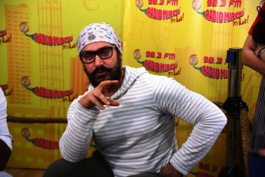 Photos of Bollywood actor Aamir Khan promotes Dangal movie at Radio Mirchi studio.
