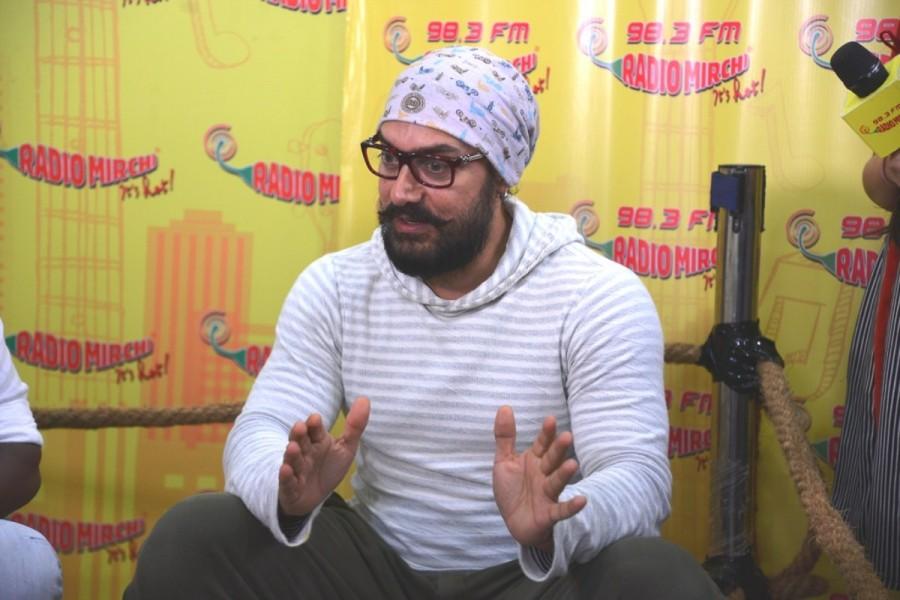 Photos of Bollywood actor Aamir Khan promotes Dangal movie at Radio Mirchi studio. Aamir Khan,actor Aamir Khan,Aamir Khan promotes Dangal movie,Aamir Khan promotes Dangal,Aamir Khan promotes Dangal at Radio Mirchi studio,Aamir Khan's Dangal,Dangal movie,Dangal movie promotion,Dangal movie promotion pics,Dangal movie promotion image