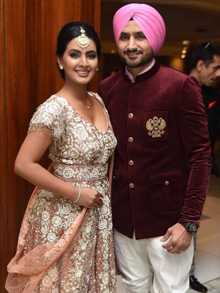 Harbhajan Singh and his wife Geeta Basra during wedding reception of cricketer Yuvraj Singh and actress Hazel Keech in New Delhi, on Dec 7, 2016. MS Dhoni,Harbhajan Singh,Sourav Ganguly,Yuvraj Singh and Hazel Keech's wedding reception,Yuvraj Singh wedding reception,Yuvraj Singh wedding reception pics,Yuvraj Singh wedding reception images,Yuvraj Singh wedding reception photos,Yuvraj Singh wed
