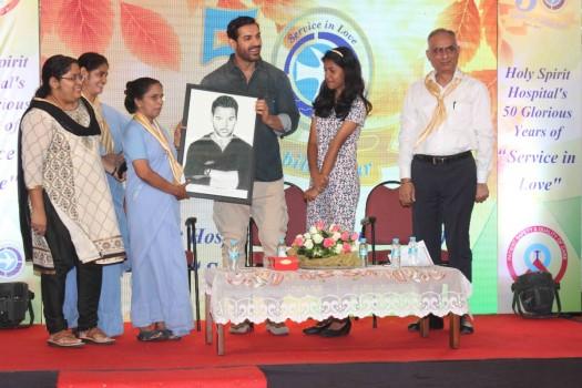 Photos of Bollywood actor John Abraham graces the Holy Spirit Hospital golden jubilee celebrations.