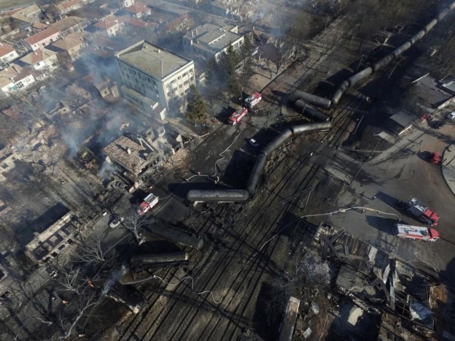 An aerial view shows the site where a cargo train derailed and exploded in the village of Hitrino, Bulgaria. Train derailment,Bulgaria train derailment,cargo train derails,Bulgaria,7 Killed,29 Injured in Bulgarian Tanker Train Explosion,Bulgarian Tanker Train Explosion,Tanker Train Explosion,freight train derailed