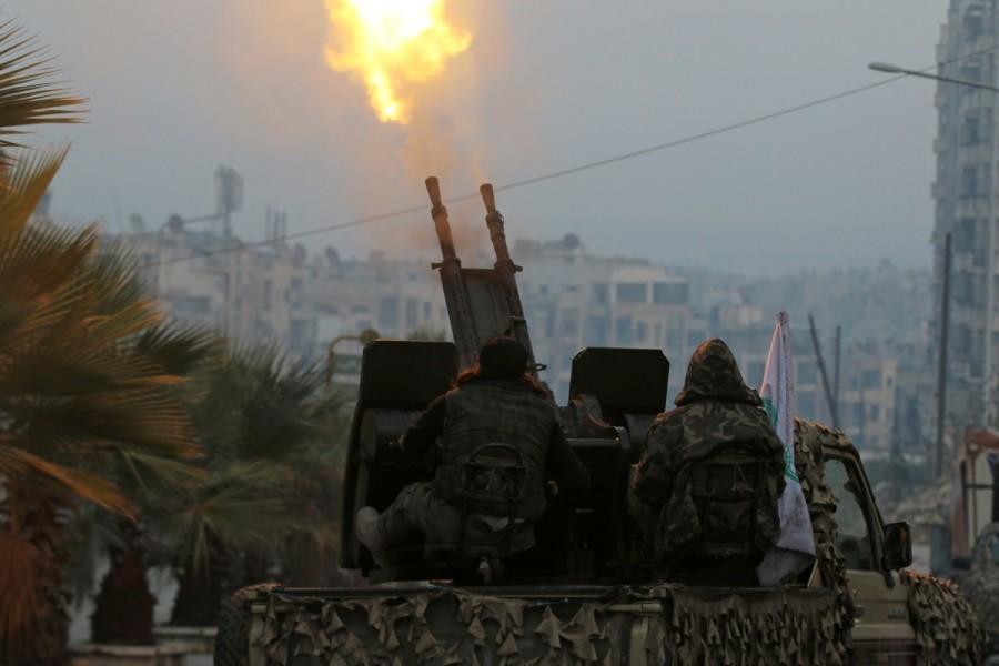 Free Syrian Army fighters fire an anti-aircraft weapon in a rebel-held area of Aleppo, Syria December 12, 2016. Aleppo's rebels,Aleppo rebels,Rebels Holding Out in Aleppo Video,Aleppo Video,Beleaguered Rebels,President Bashar al-Assad,Bashar al-Assad