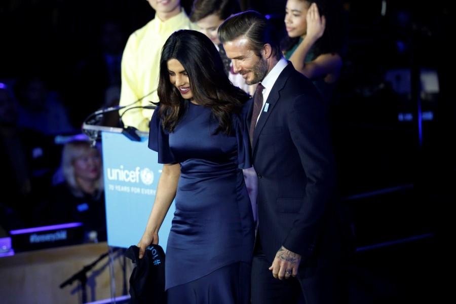 Priyanka Chopra and David Beckham (R) exit the stage at the UNICEF 70th anniversary event at the United Nations Headquarters in Manhattan, New York City, U.S., December 12, 2016. Priyanka Chopra,David Beckham,Orlando Bloom,UNICEF Global Goodwill Ambassador,UNICEF 70th anniversary,United Nations Headquarters