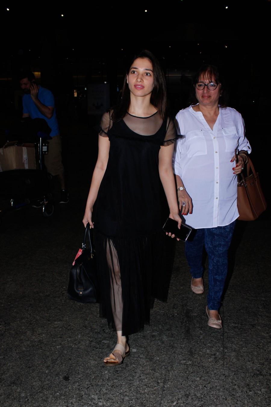 Photos of South Indian actress Tamannaah Bhatia spotted at Mumbai airport, in Mumbai on December 13, 2016. Tamannaah Bhatia,Tamannaah,actress Tamannaah Bhatia,Tamannaah spotted at Mumbai airport,Tamannaah at Mumbai airport,Tamannaah new pics,Tamannaah new images,Tamannaah new photos,Tamannaah new stills,Tamannaah new pictures