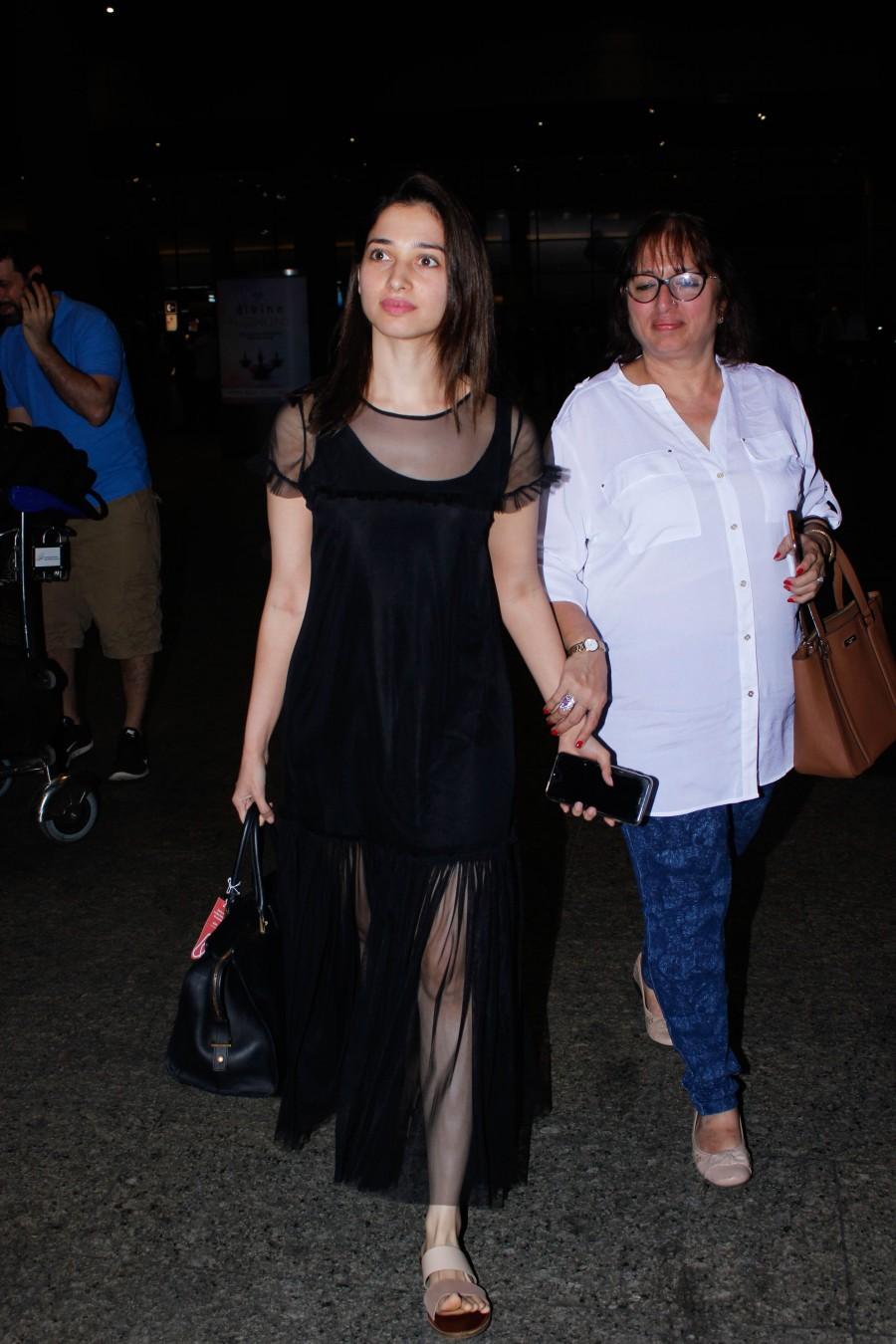 Photos of South Indian actress Tamannaah Bhatia spotted at Mumbai airport, in Mumbai on December 13, 2016. Tamannaah Bhatia,Tamannaah,actress Tamannaah Bhatia,Tamannaah spotted at Mumbai airport,Tamannaah at Mumbai airport,Tamannaah new pics,Tamannaah new images,Tamannaah new photos,Tamannaah new stills,Tamannaah new pictures