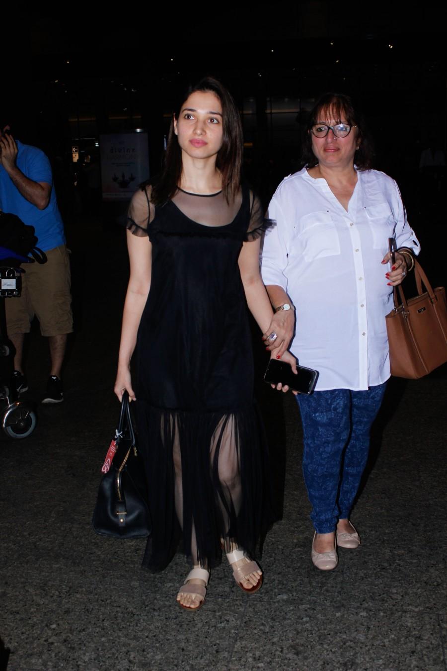 Photos of South Indian actress Tamannaah Bhatia spotted at Mumbai airport, in Mumbai on December 13, 2016. Tamannaah Bhatia,Tamannaah,actress Tamannaah Bhatia,Tamannaah spotted at Mumbai airport,Tamannaah at Mumbai airport,Tamannaah new pics,Tamannaah new images,Tamannaah new photos,Tamannaah new stills,Tamannaah new pictures