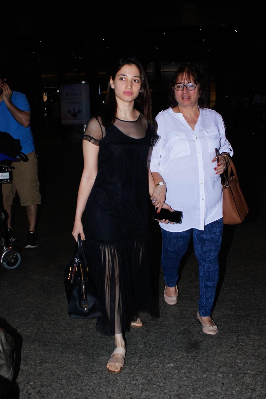 Photos of South Indian actress Tamannaah Bhatia spotted at Mumbai airport, in Mumbai on December 13, 2016. Tamannaah Bhatia,Tamannaah,actress Tamannaah Bhatia,Tamannaah spotted at Mumbai airport,Tamannaah at Mumbai airport,Tamannaah new pics,Tamannaah new images,Tamannaah new photos,Tamannaah new stills,Tamannaah new pictures
