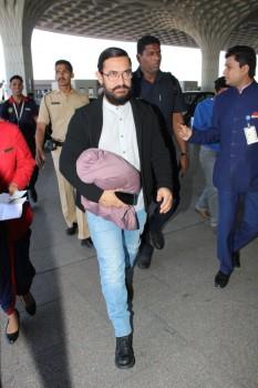 Photos of Bollywood actor Aamir Khan spotted at Mumbai Airport.