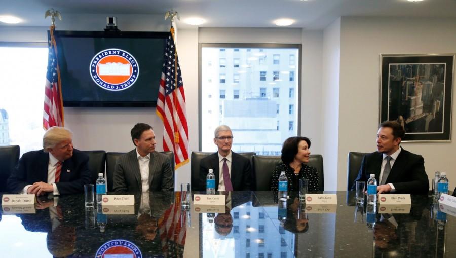 U.S. President-elect Donald Trump sits with PayPal co-founder and Facebook board member Peter Thiel, Apple Inc CEO Tim Cook, Oracle CEO Safra Catz and Tesla Chief Executive Elon Musk during a meeting with technology leaders at Trump Tower in New York U.S., December 14, 2016. Donald Trump,Silicon Valley elite,Trump meets Silicon Valley elite,Donald Trump woos Silicon Valley tech elite,Trump meets Silicon Valley elite after mutual,Donald Trump And Silicon Valley Elite Seek