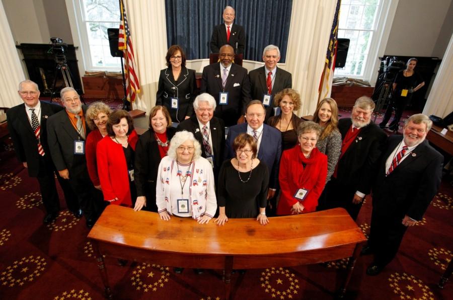 North Carolina's Electoral College representatives pose for a group photo after formally voting for President-elect Donald Trump in the State Capitol building in Raleigh, North Carolina. Donald Trump,Electoral College vote,Donald Trump wins Electoral College vote,president,270 electoral votes,White House