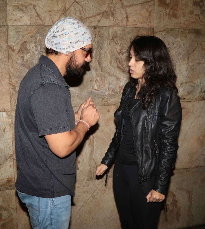 Bollywood actor Aamir Khan along with daughter Ira Khan during the special screening of film Dangal in Mumbai. Dangal special screening,Dangal screening,Kangana Ranaut,Reena Dutta,Ira Khan,Ajinkya Rahane,Dangal special screening pics,Dangal special screening images,Dangal special screening photos,Dangal special screening stills,Dangal special screening pictures