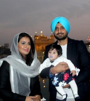 Indian cricketer Harbhajan Singh with his wife Geeta Basra and daughter Hinaya Heer Plaha pay obeisance at the Golden Temple in Amritsar on Dec 22, 2016.