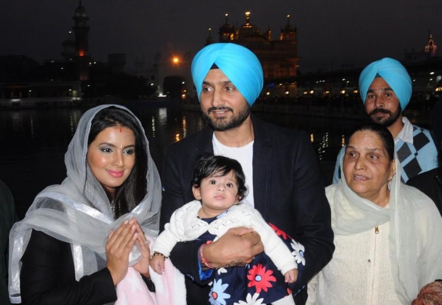 Indian cricketer Harbhajan Singh with his wife Geeta Basra and daughter Hinaya Heer Plaha pay obeisance at the Golden Temple in Amritsar on Dec 22, 2016. Harbhajan Singh,Geeta Basra,Harbhajan Singh and Geeta Basra,Hinaya Heer Plaha,Harbhajan Singh daughter Hinaya,Harbhajan Singh daughter Hinaya Heer Plaha,Golden Temple,Geeta Basra daughter,Geeta Basra daughter Hinaya Heer Plaha