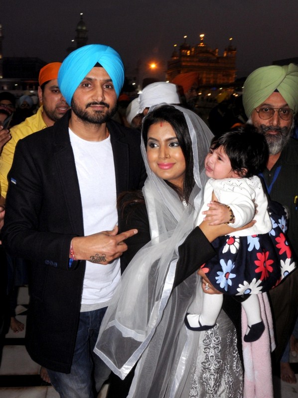 Indian cricketer Harbhajan Singh with his wife Geeta Basra and daughter Hinaya Heer Plaha pay obeisance at the Golden Temple in Amritsar on Dec 22, 2016. Harbhajan Singh,Geeta Basra,Harbhajan Singh and Geeta Basra,Hinaya Heer Plaha,Harbhajan Singh daughter Hinaya,Harbhajan Singh daughter Hinaya Heer Plaha,Golden Temple,Geeta Basra daughter,Geeta Basra daughter Hinaya Heer Plaha