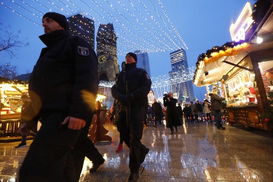 Police patrol at the re-opened Christmas market at Breitscheid square. Berlin opens Christmas market,Berlin market,Christmas market,Christmas,Christmas 2016,Berlin Attack,Berlin Christmas market attack,berlin truck attack,Berlin Christmas market