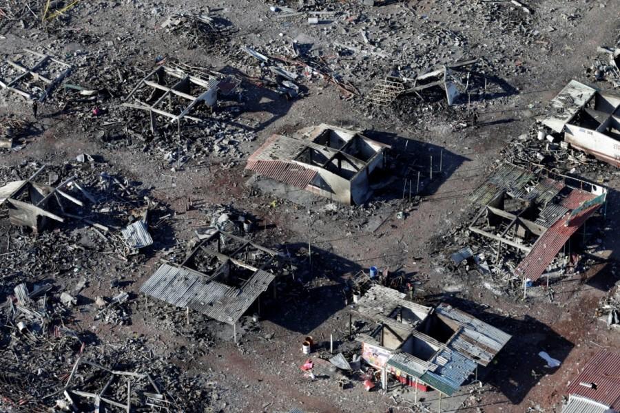 An aerial view shows the wreckage of houses destroyed in an explosion at the San Pablito fireworks market after an explosion, outside the Mexican capital, in Tultepec, Mexico, December 21, 2016. Mexico fireworks market,mexico fireworks market blast,Deadly blast at Mexico,Mexico blast,fireworks market,San Pablito fireworks market,San Pablito fireworks,Mexican capital,Tultepec