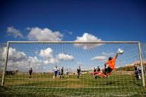 Players from Israeli soccer clubs affiliated with Israel Football Association, Ariel Municipal Soccer Club and Maccabi HaSharon Netanya, play against each other at Ariel Municipal Soccer Club's training grounds in the West Bank Jewish settlement of Ariel.