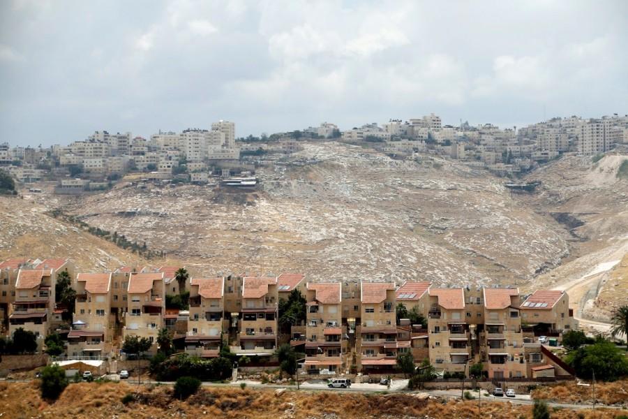 Houses are seen in the West Bank Jewish settlement of Maale Adumim as the Palestinian village of Al-Eizariya is seen in the background. Israeli,life in Israeli,Life in Israeli settlements,U.N. Security Council
