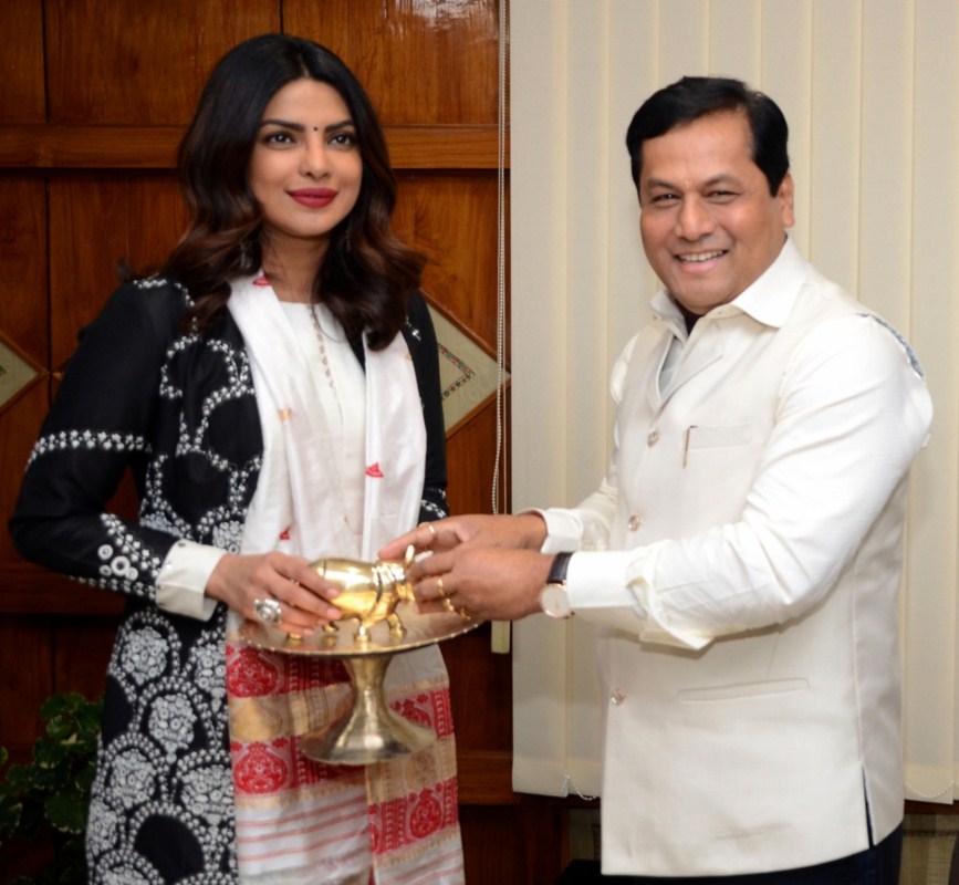 Assam Chief Minister Sarbananda Sowonal felicitate actress Priyanka Chopra the brand ambassador of Assam tourism with a pride of Assam "Rhino" in Guwahati on Dec 24, 2016. Sarbananda Sowonal,Assam Chief Minister Sarbananda Sowonal,Chief Minister Sarbananda Sowonal,Priyanka Chopra,actress Priyanka Chopra,Rhino,Assam tourism,Brand Ambassador Of Assam Tourism