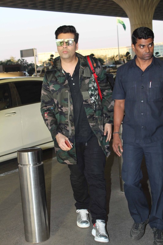 Director Karan Johar spotted at airport. Karan Johar,Raveena Tandon,Shriya Saran,Karan Johar spotted at airport,Raveena Tandon spotted at airport,Shriya Saran spotted at airport,Celebs spotted at airport,Celebs at airport