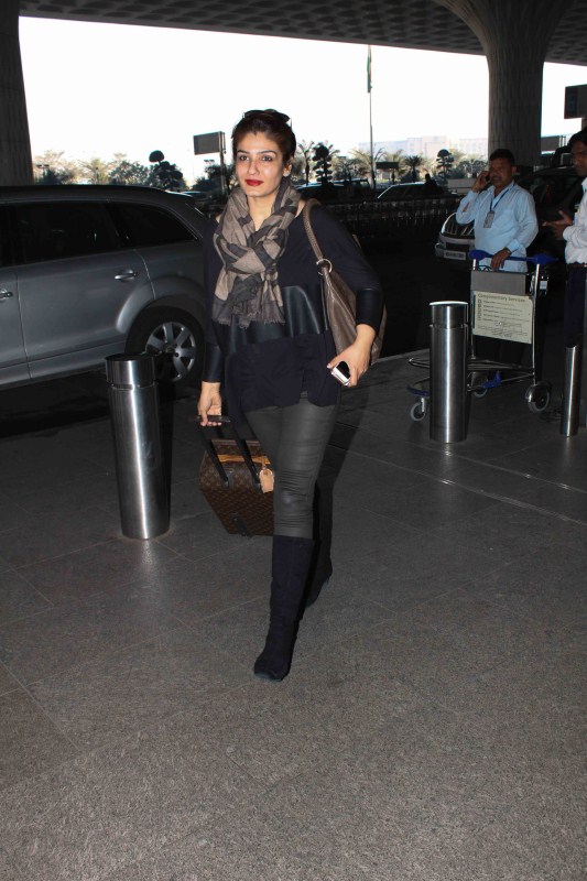 Bollywood actress Raveena Tandon spotted at airport. Karan Johar,Raveena Tandon,Shriya Saran,Karan Johar spotted at airport,Raveena Tandon spotted at airport,Shriya Saran spotted at airport,Celebs spotted at airport,Celebs at airport