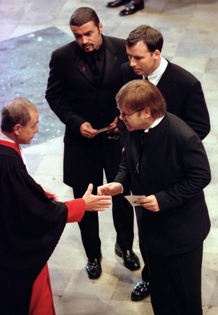 Pop singer George Michael (top), fellow musician Elton John (R) and his companion David Furnish (C), are greeted at the funeral service for Diana, Princess of Wales at Westminster Abbey, September 6. George Michael,george michael dead,George Michael death,George Michael photos,life in photos,George Michael with princess Diana,George Michael Paul McCartney,George Michael dies at 53,British singer George Michael