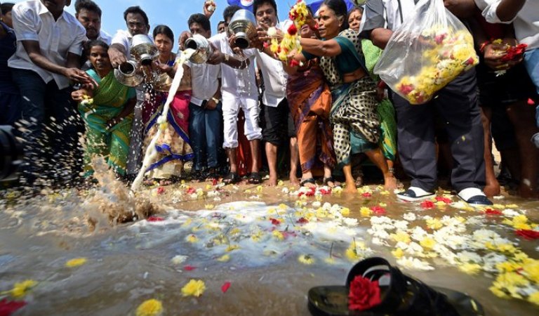 Silent rallies were held in tsunami affected areas as people offered milk and flowers to the sea for the dead. 2004 Tsunami Victims,2004 Tsunami,Tsunami Victims,Tsunami,homage to Tsunami Victims