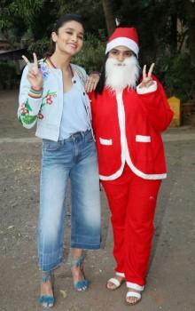 Bollywood actress Alia Bhatt celebrates Christmas with orphaned kids in Mumbai on December 25, 2016.