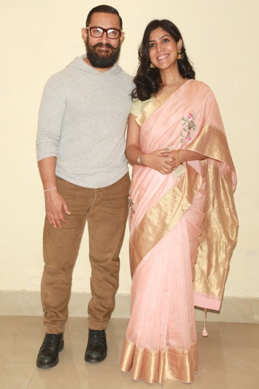 Actors Aamir Khan and Sakshi Tanwar during a special screening of film "Dangal" in New Delhi on Dec 27, 2016. Aamir Khan,Nitin Gadkari,Shaina NC,Union Minister for Road Transport,Dangal Special screening,Dangal movie Special screening,Dangal Special screening pics,Dangal Special screening images,Dangal Special screening photos,Dangal Special screening stills,Dang
