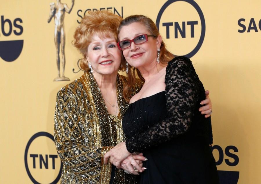 Actress Debbie Reynolds poses with her daughter actress Carrie Fisher backstage after accepting her Lifetime Achievement award at the 21st annual Screen Actors Guild Awards in Los Angeles, California January 25, 2015. Debbie Reynolds and Carrie Fisher,Debbie Reynolds,Carrie Fisher,Debbie Reynolds and Carrie Fisher rare pics,Debbie Reynolds and Carrie Fisher pics,Debbie Reynolds and Carrie Fisher images,Debbie Reynolds and Carrie Fisher photos,Debbie Reynolds and Carrie