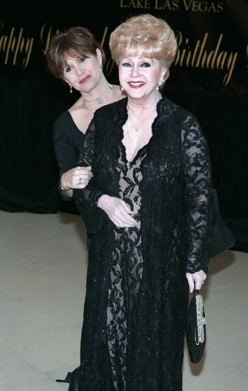 Actress Carrie Fisher (L) and her mother, actress Debbie Reynolds, pose as they arrive for Elizabeth Taylor's 75th birthday party at the Ritz-Carlton in Lake Las Vegas, in Henderson, Nevada February 27, 2007. Debbie Reynolds and Carrie Fisher,Debbie Reynolds,Carrie Fisher,Debbie Reynolds and Carrie Fisher rare pics,Debbie Reynolds and Carrie Fisher pics,Debbie Reynolds and Carrie Fisher images,Debbie Reynolds and Carrie Fisher photos,Debbie Reynolds and Carrie
