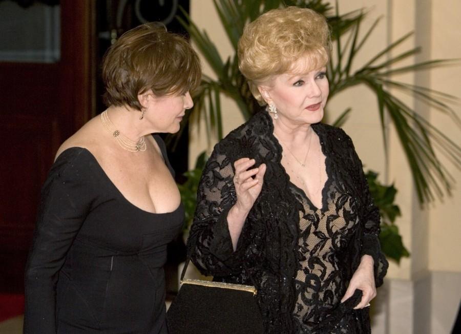 Actress Carrie Fisher (L) and her mother actress Debbie Reynolds arrive for Elizabeth Taylor's 75th birthday party at the Ritz-Carlton in Lake Las Vegas, in Henderson, Nevada February 27, 2007. Debbie Reynolds and Carrie Fisher,Debbie Reynolds,Carrie Fisher,Debbie Reynolds and Carrie Fisher rare pics,Debbie Reynolds and Carrie Fisher pics,Debbie Reynolds and Carrie Fisher images,Debbie Reynolds and Carrie Fisher photos,Debbie Reynolds and Carrie