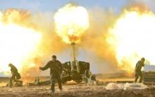 Members of Hashid Shaabi or Popular Mobilization Forces (PMF) fire towards Islamic State militant positions in west of Mosul, Iraq. Iraqi security forces on Thursday began the second phase of their offensive against Islamic State militants in Mosul, pushing from three directions into eastern districts where the battle has been deadlocked for nearly a month.
