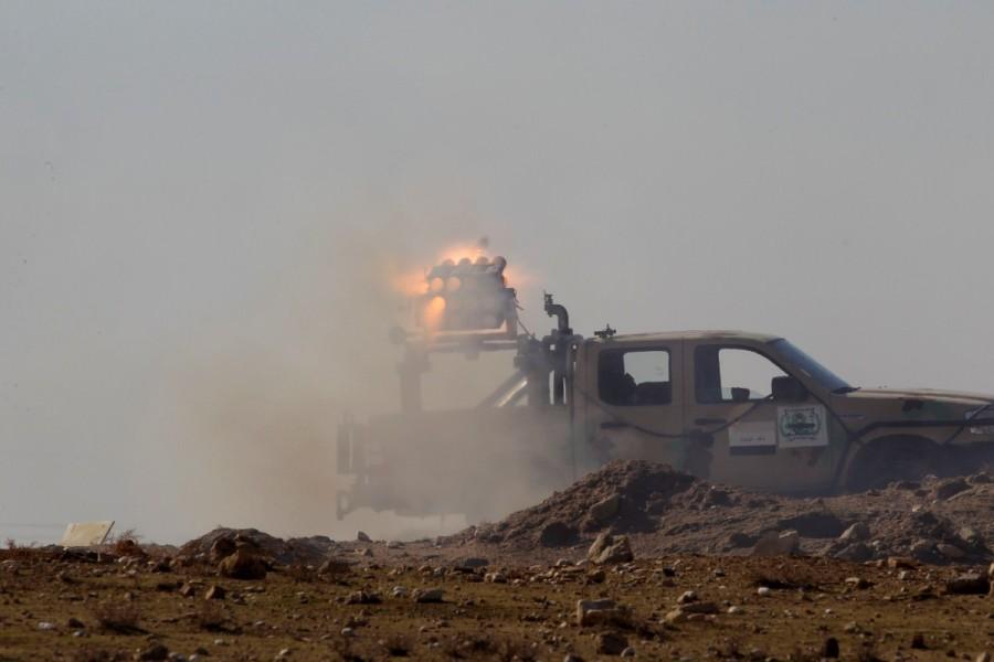 Iraqi army personnel fire toward Islamic State militants, north of Mosul. Other soldiers pushed simultaneously towards the city's northern limits. U.S. military advisers were seen watching operations. A U.S.-led coalition backing the Iraqis said the operation had opened two new fronts inside Mosul and limited Islamic State's ability to raise fighter numbers, move them or resupply. Second phase of Mosul,Mosul,Mosul offensive begins,Islamic State militants,Iraqi security forces,Islamic State,Battle of Mosul